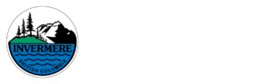 The Invermere British Columbia on the lake logo with mountain peaks and forests overlooking lake waters indie a circle in green, black and blue.